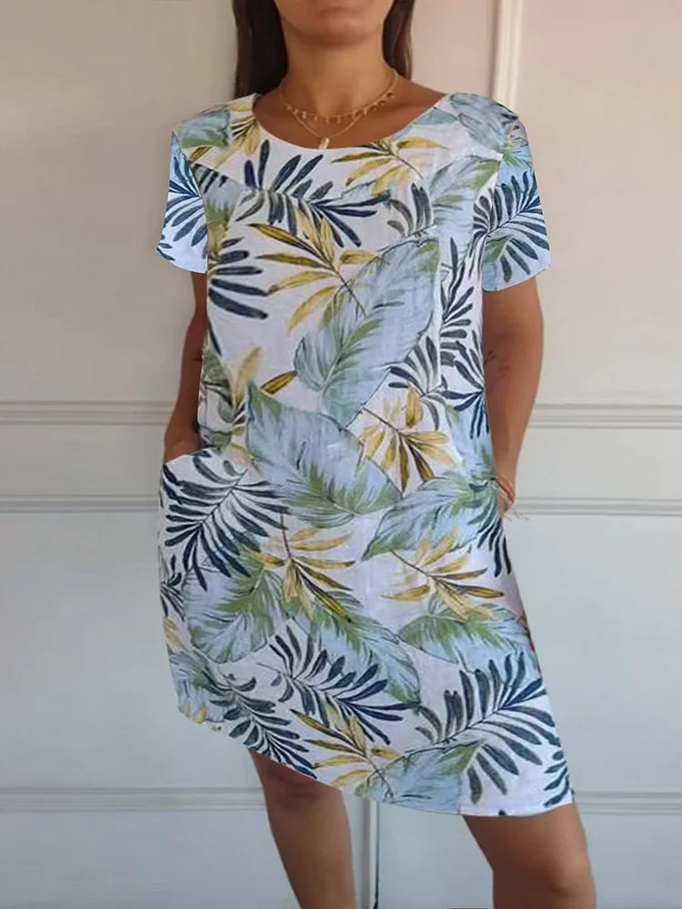 Frühlingshaftes Damenkleid mit floralem Print. Bequemes Kurzarm-Minikleid mit Taschen, ideal für Sonne & Freizeit.