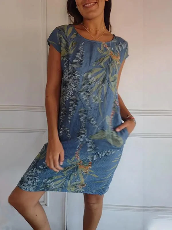 Modisches Damen Minikleid mit lebhaftem Blumenmuster. Bequemes Kurzarm-Freizeitkleid für Frühling und Sommer.