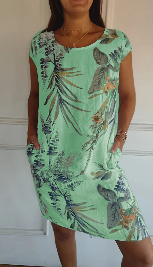 Leichtes Damen Sommerkleid mit fröhlichem Blumendruck. Kurzarm-Minikleid für entspannte Sommertage und Freizeit.