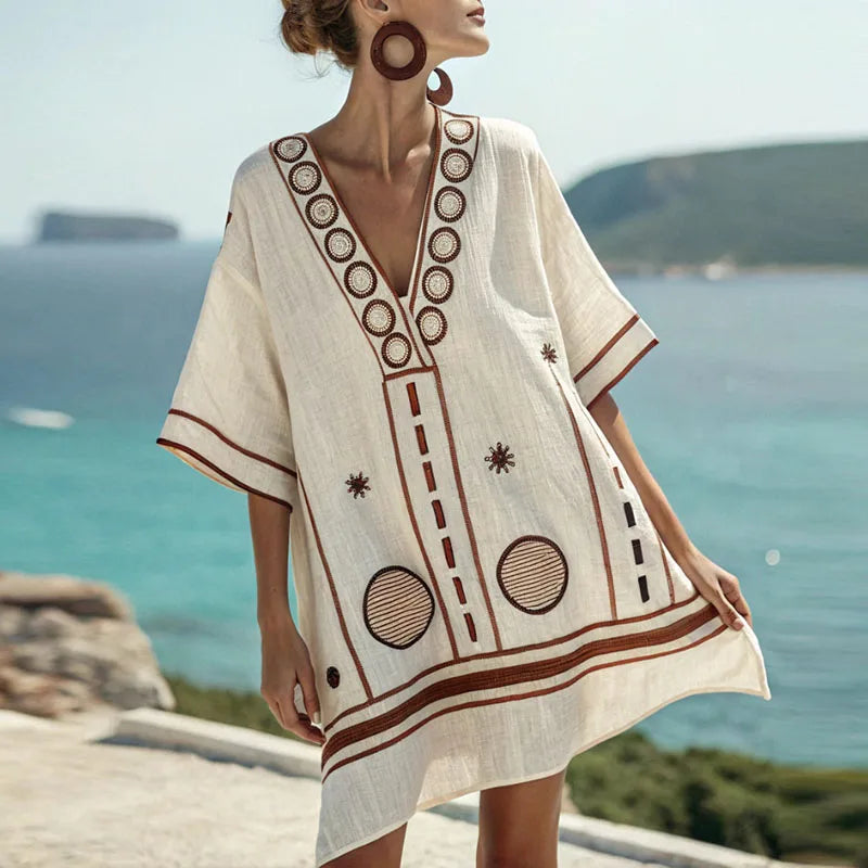Damen Strandkleid Gwen: elegant-bequemes schwarz-oranges Minikleid mit V-Ausschnitt. Perfekt als Sommer- oder Urlaubskleid.