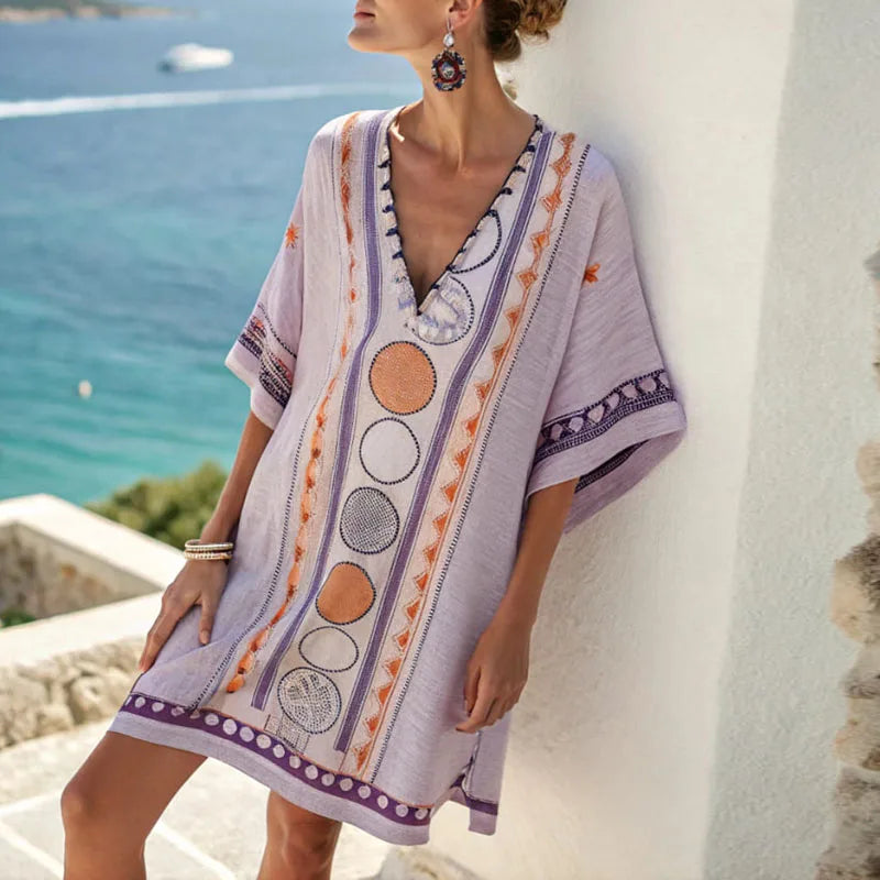 Damen Strandkleid mit Blumenmuster, locker geschnittenem V-Ausschnitt. Elegantes, bequemes Sommerkleid für Freizeit & Urlaub.