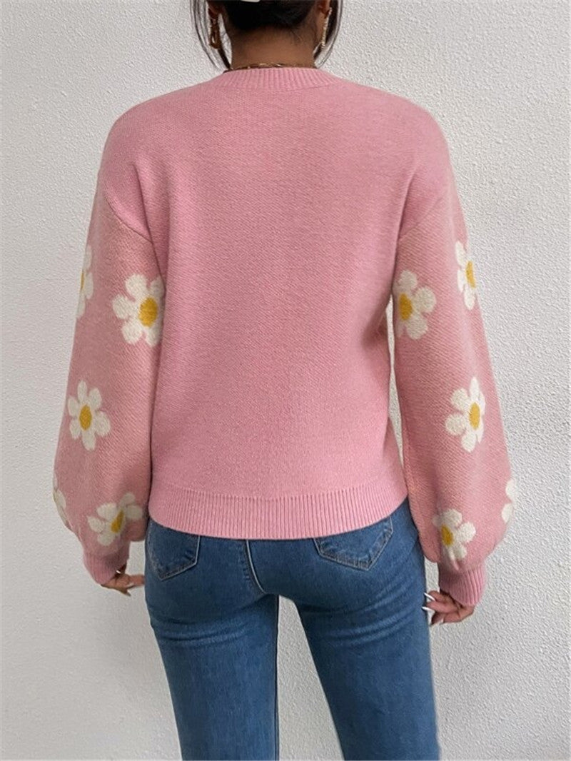 Eleganter & femininer Damen Strickpullover mit detailreichem Blumenprint & stylischen Puffärmeln.