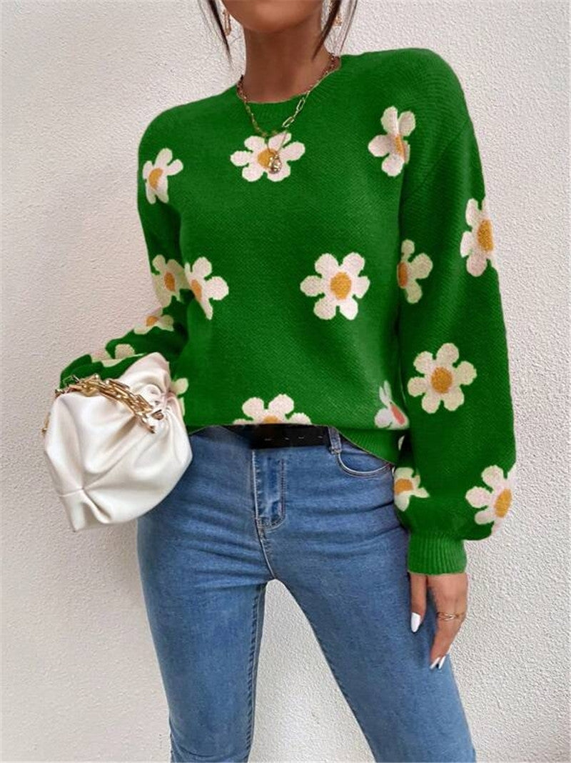 Frühlingshafter Damen Strickpullover mit farbenfrohem Blumenmuster, bequemen Puffärmeln & Rundhals.