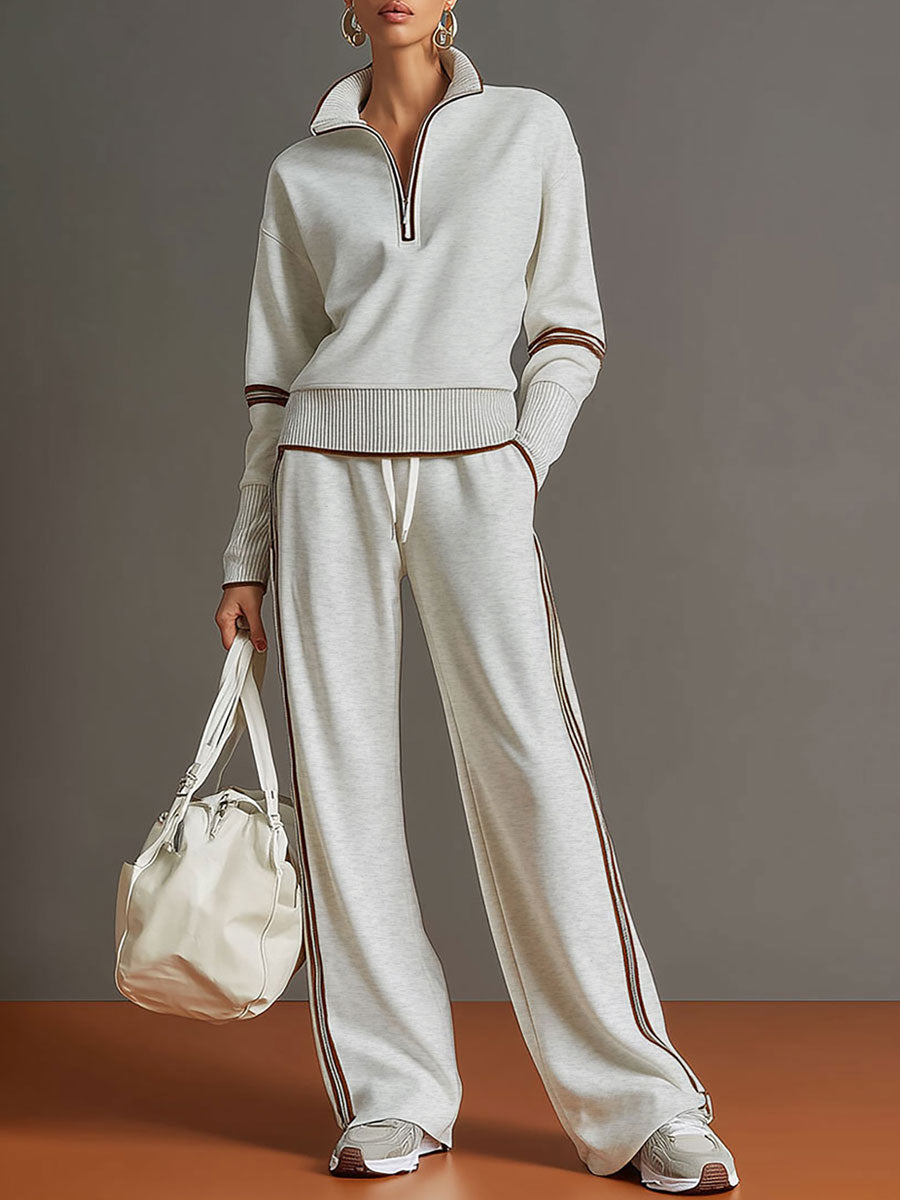 Damen Vintage Freizeit-Set mit Halbzip-Sweatshirt und bequemer weiter Hose für entspannte Looks.