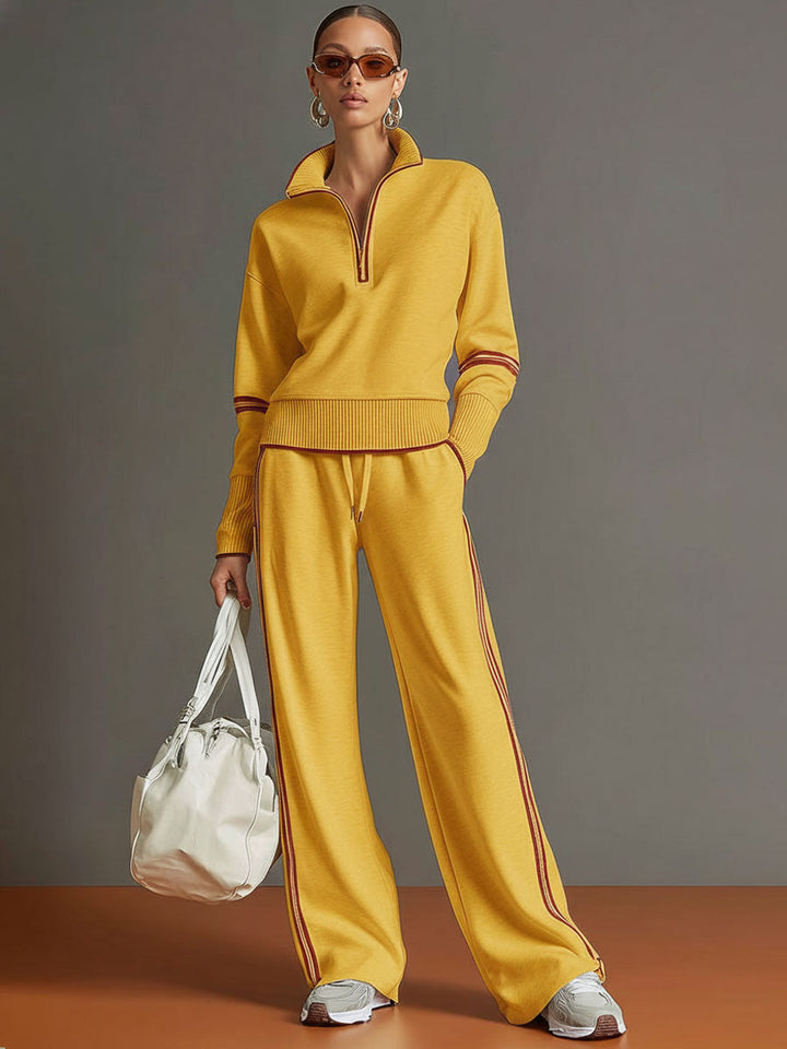 Sportlich-elegantes Damen Vintage Freizeit-Set mit Halbzip-Sweatshirt und weiter Freizeithose, dezent.