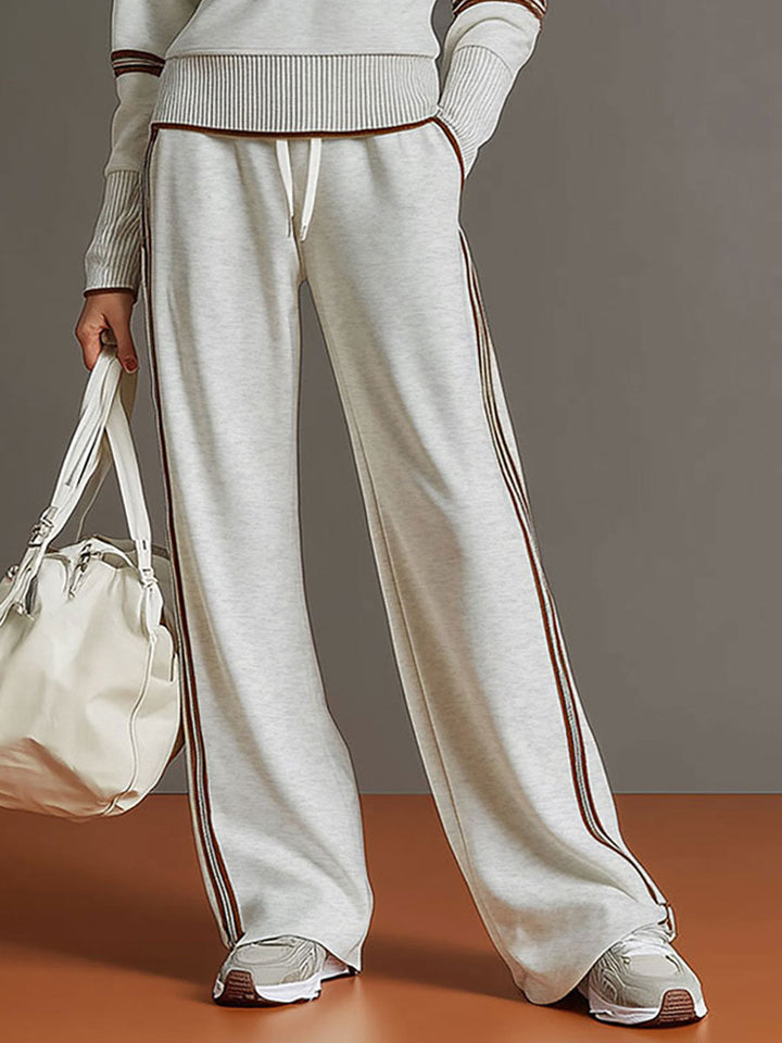 Lässiges Damen Vintage-Freizeit-Set: Halbzip-Sweatshirt und weite Stoffhose, perfekt für Zuhause.