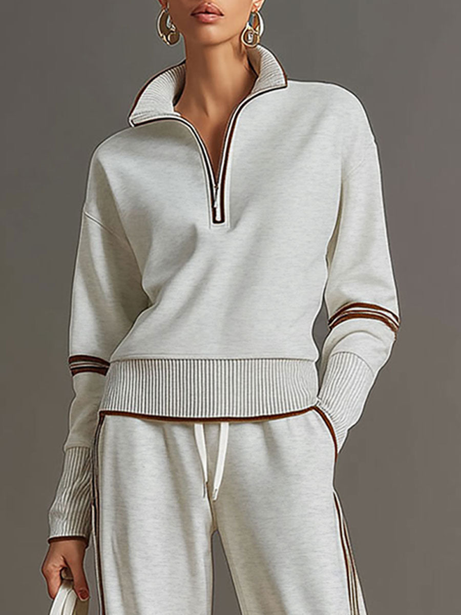 Damen Vintage Freizeit-Set mit Halbzip-Sweatshirt und weiter Hose für einen entspannten Loose-Fit.