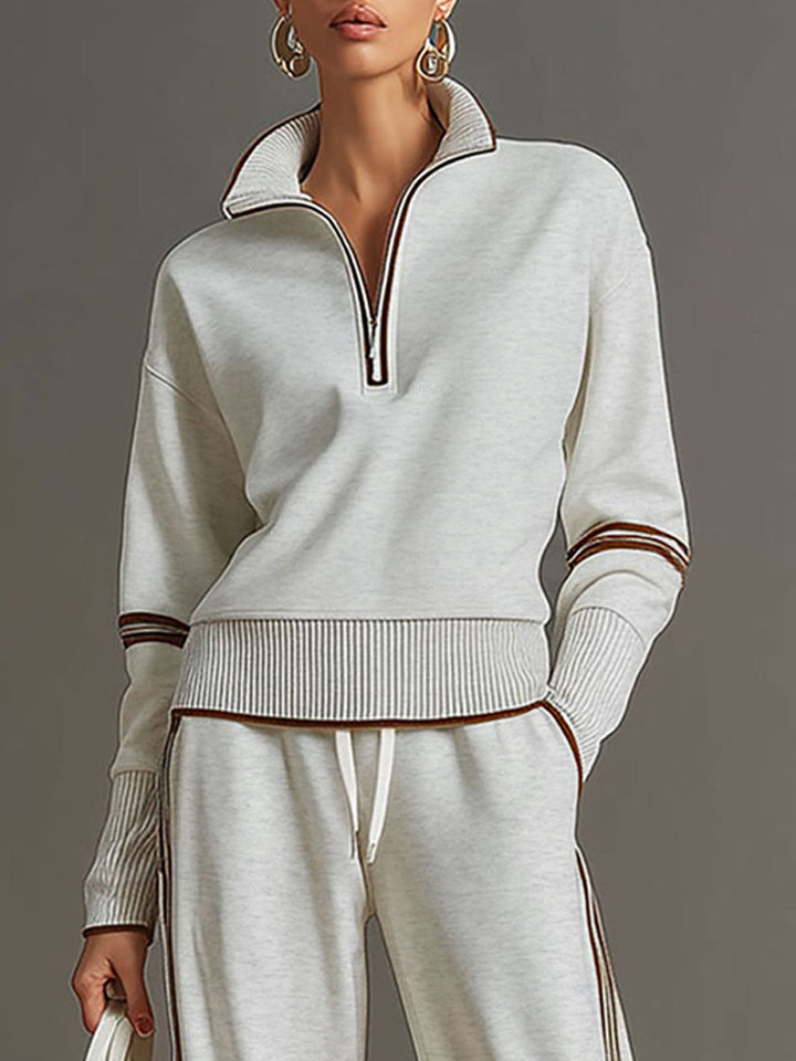 Damen Vintage Freizeit-Set mit Halbzip-Sweatshirt und weiter Hose für einen entspannten Loose-Fit.