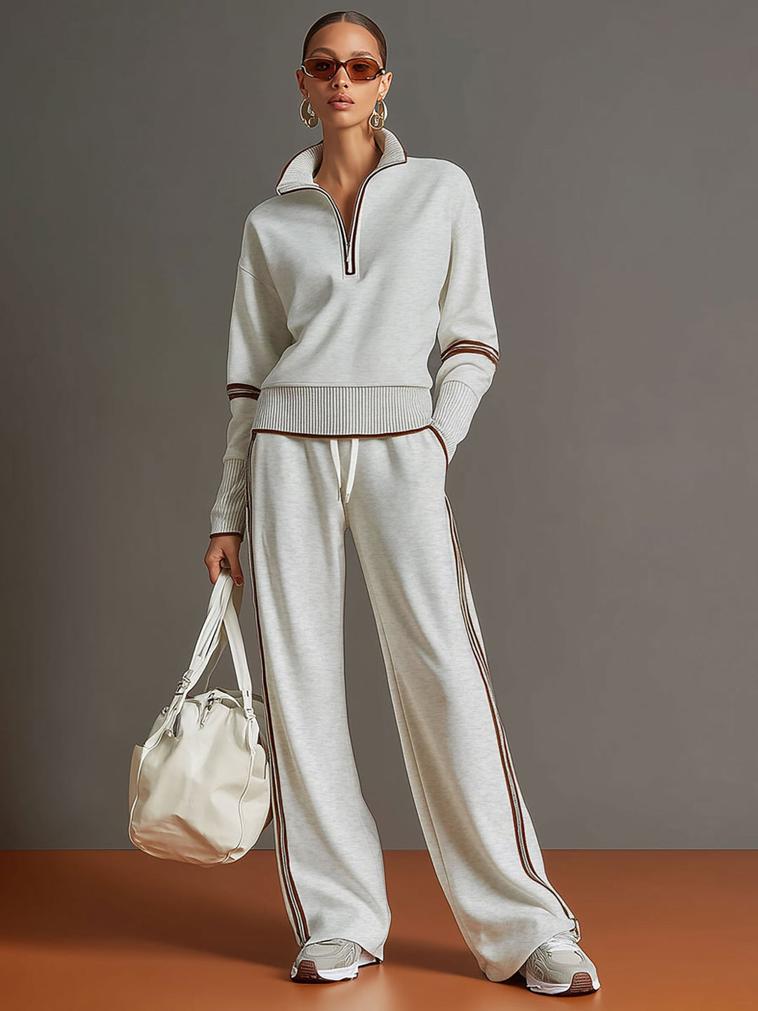 Modisches Damen Vintage Sport-Set: Halbzip-Oberteil und weite Freizeithose für entspannte Tage.