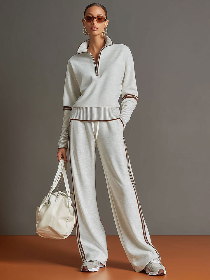 Modisches Damen Vintage Sport-Set: Halbzip-Oberteil und weite Freizeithose für entspannte Tage.