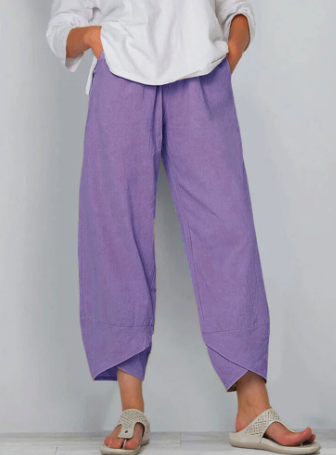 Nahaufnahme: Asymmetrischer Bund der Damen Vintage Freizeithose. Hohe Taille Detail.