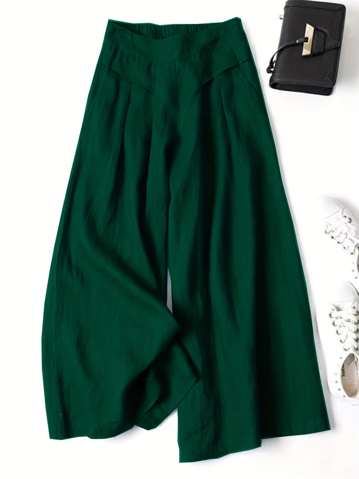 Rückenansicht der High-Waist Damen Weitbein Capri-Hose, schmeichelhafte Passform für Freizeit & Mode.