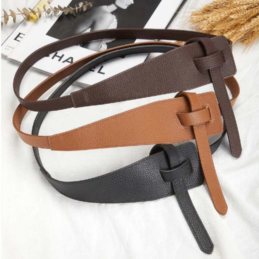 Eleganter schwarzer Unisex Taillengürtel mit dekorativem Knoten. Vielseitiges Mode-Accessoire.