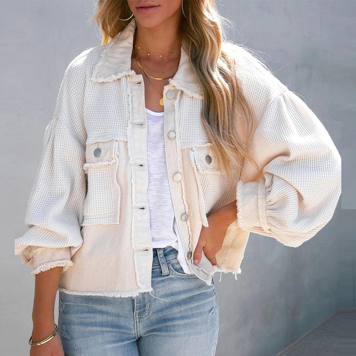 Stilvolle Damen-Kurzjacke mit eleganten Puffärmeln, perfekt als Übergangsjacke.