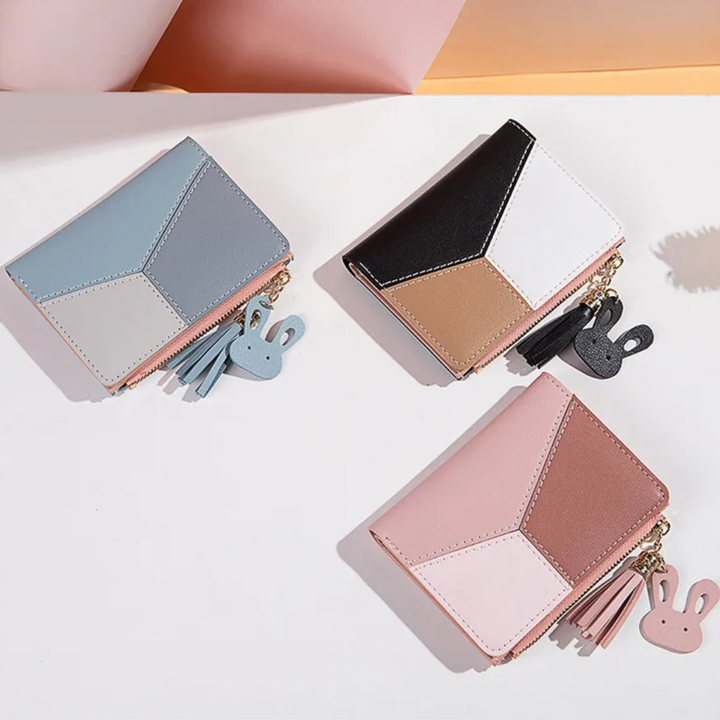 Modisches Damen Accessoire: Kurzportemonnaie mit eleganter Quaste und zuverlässigem Reißverschluss für Karten.
