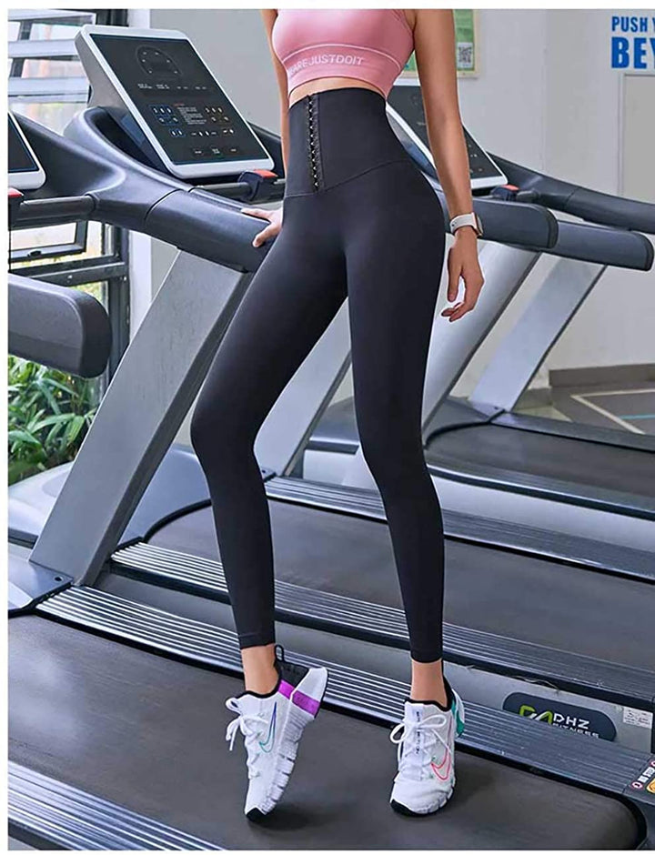 Graue Damen Kompressions-Leggings für muskelunterstützende Performance beim Training & Sport.
