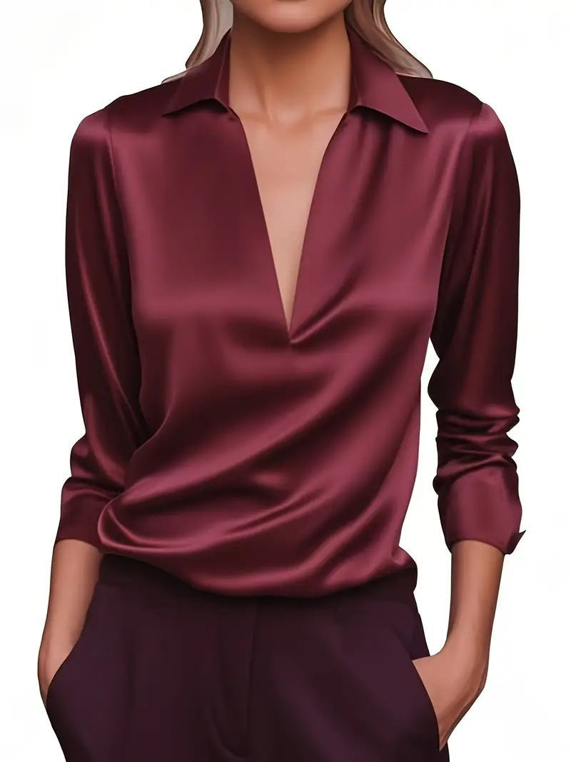 Feminin geschnittene Damenbluse im Satin-Look mit V-Ausschnitt. Elegant für Büro oder Freizeit.