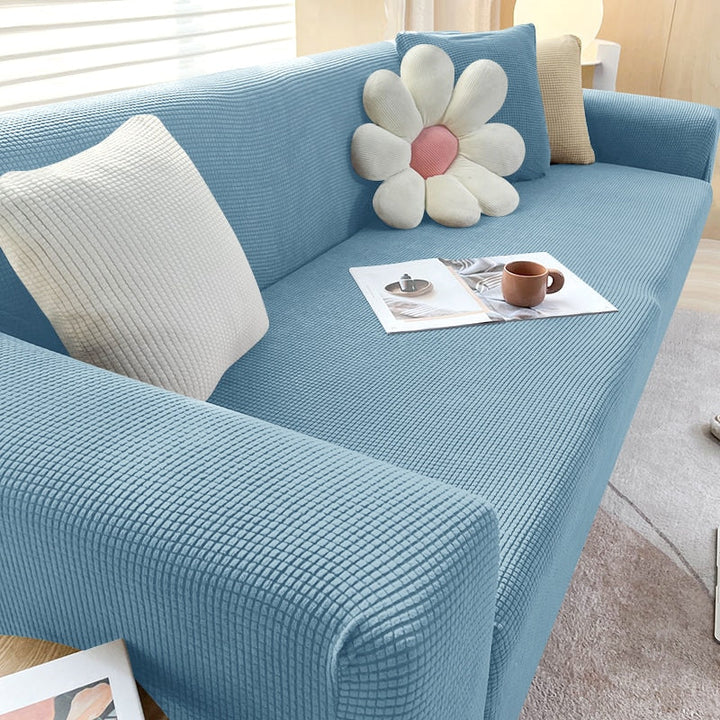Schwarze Sofahusse, dehnbare Qualität; Heimtextilien für modernen Wohnstil.