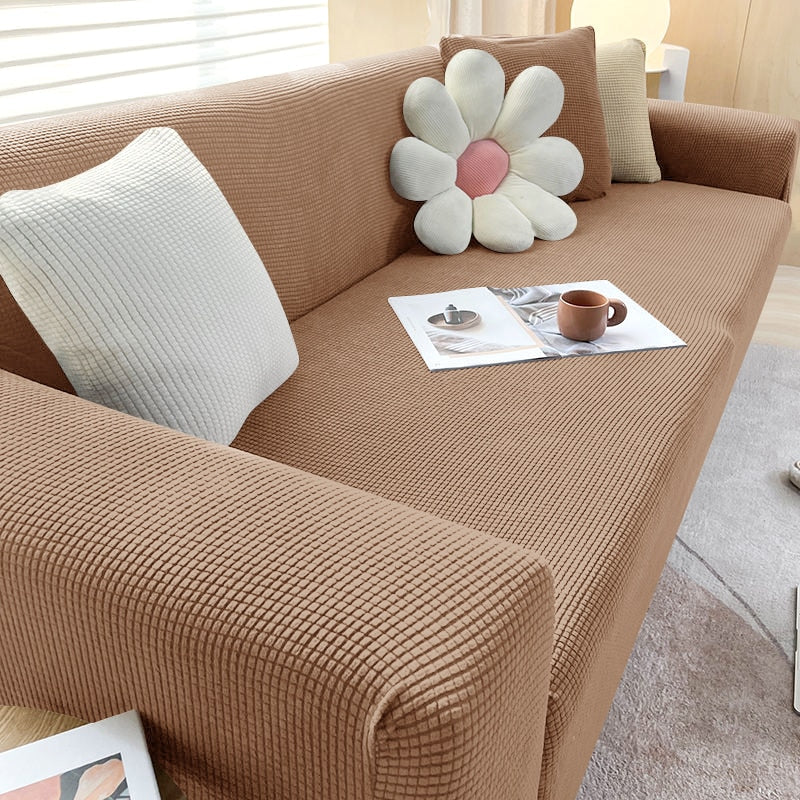 Schmutzabweisende Sofahusse, blau; elastischer Stretchbezug als tierfreundlicher Couchschutz.