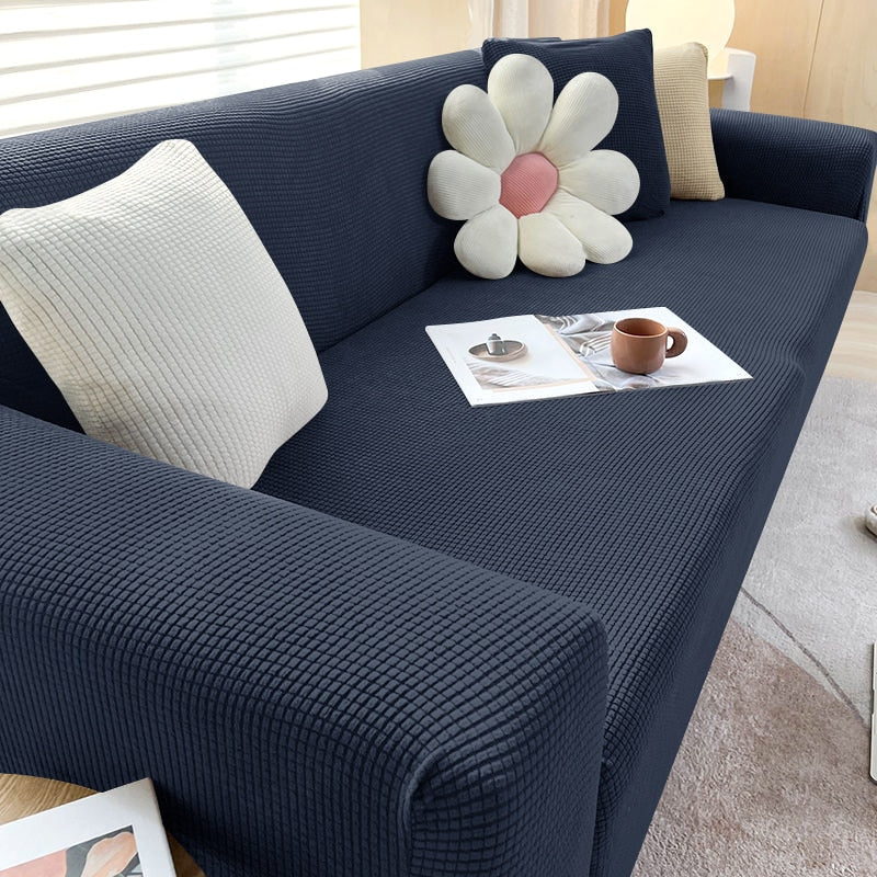 Graue Stretch-Sofahusse; perfekter Möbelschutz und neuer Look für Ihr Sofa.