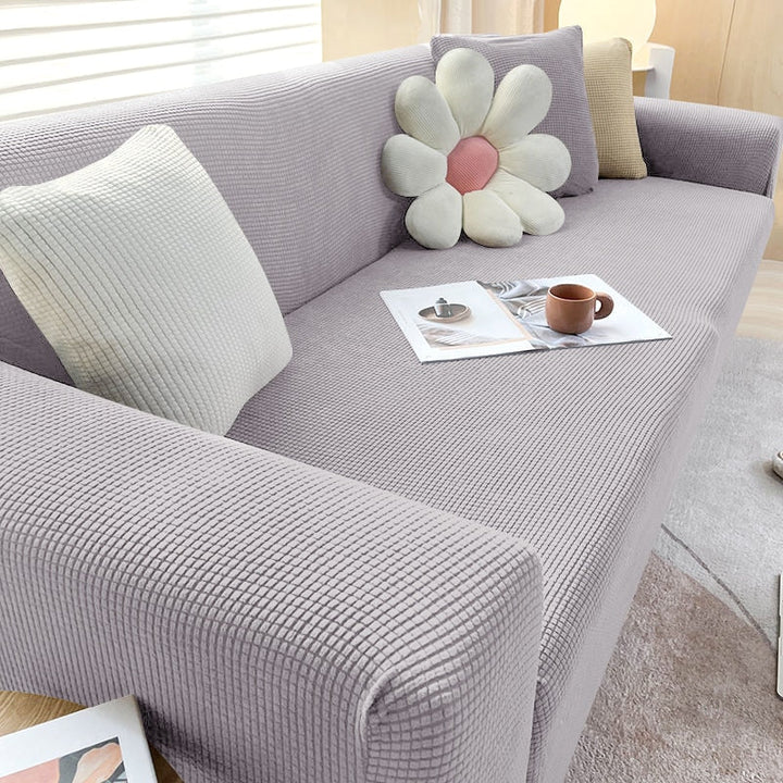 Elastischer Sofabezug in Beige; pflegeleichte Sofahusse für optimalen Couchschutz.