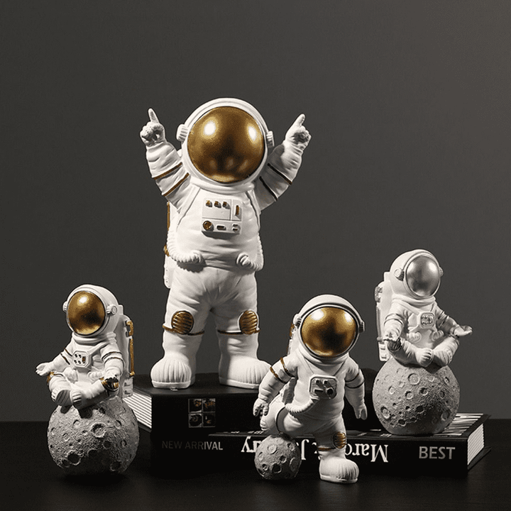 Inspirierende Astronauten-Deko aus Harz, gold-silber, ideal für Weltraum-Enthusiasten und Büros.