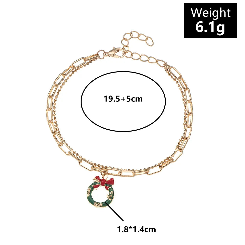 Festliches Damen Gliederketten Charme Armband, reich verziert mit verschiedenen Weihnachtssymbolen.