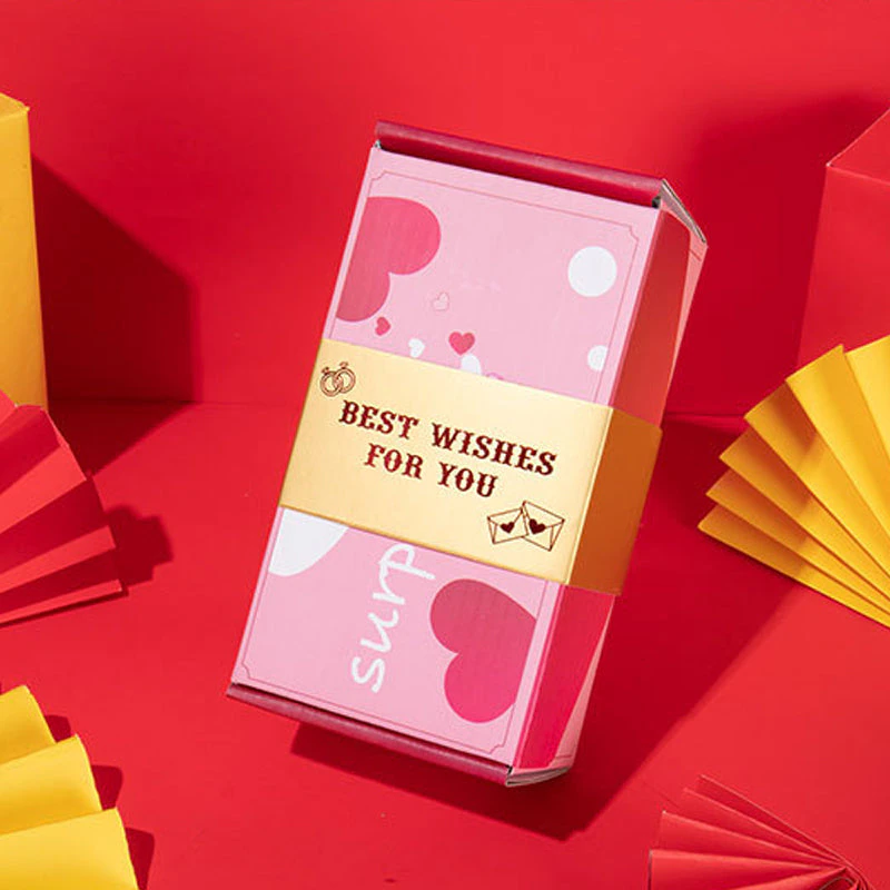 Wiederverwendbare Karton-Geschenkbox für festliche Anlässe, mit überraschendem Öffnungseffekt.