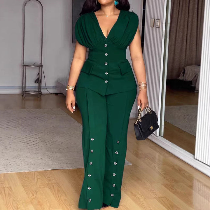 Dunkelgrüner Damen Jumpsuit mit tiefem V-Ausschnitt & Puffärmeln, perfekt für elegante Anlässe und Abendmode.