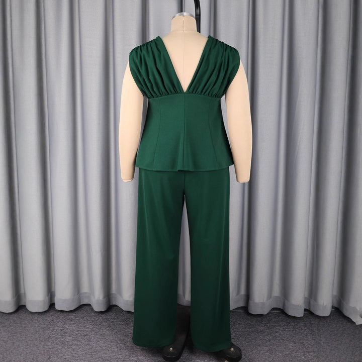 Eleganter dunkelgrüner Damen Jumpsuit mit Puffärmeln & tiefem V-Ausschnitt, stylisch und komfortabel für Events.