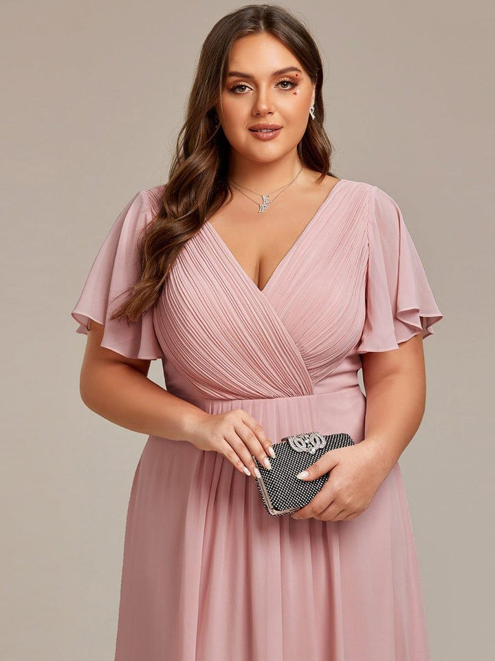 Glamouröses Puderrosa Vokuhila Abendkleid, figurschmeichelnde A-Linie und Empire-Taille; festlich.