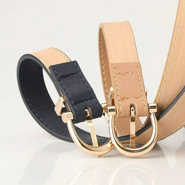 Detail des Gürtelendes und der Metallschnalle eines eleganten Unisex-Accessoires.
