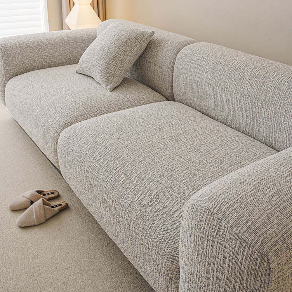 Bequemer, elastischer Chenille Sofaschutz in eleganter Farbe, ganzjährig nutzbar als stilvolles Wohnaccessoire.