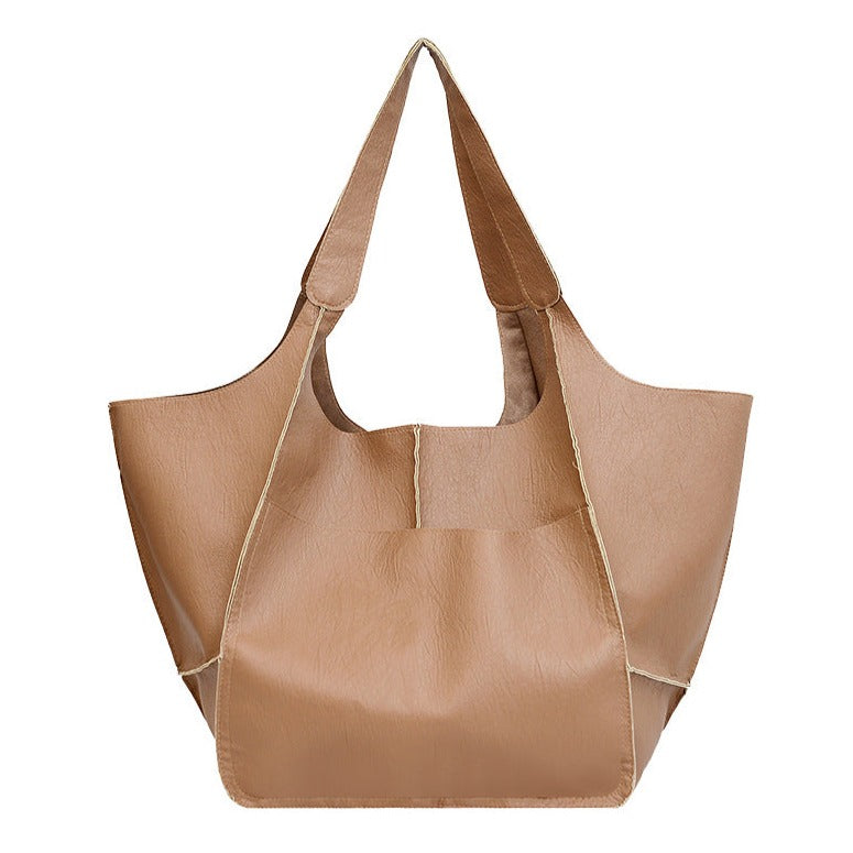 Elegante Damen Handtasche aus weichem veganem Leder, leicht & geräumig, ideal als stilvolle Alltagstasche.