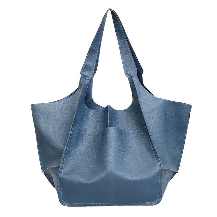 Damen Handtasche aus veganem Leder als modische Schultertasche getragen, elegant, leicht & komfortabel.