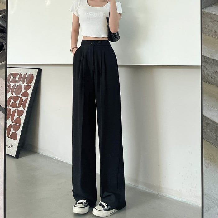 Bequeme Damen Wide-Leg Stoffhose mit High-Waist-Schnitt, lässig und elegant für Freizeitlooks und den Sommer.