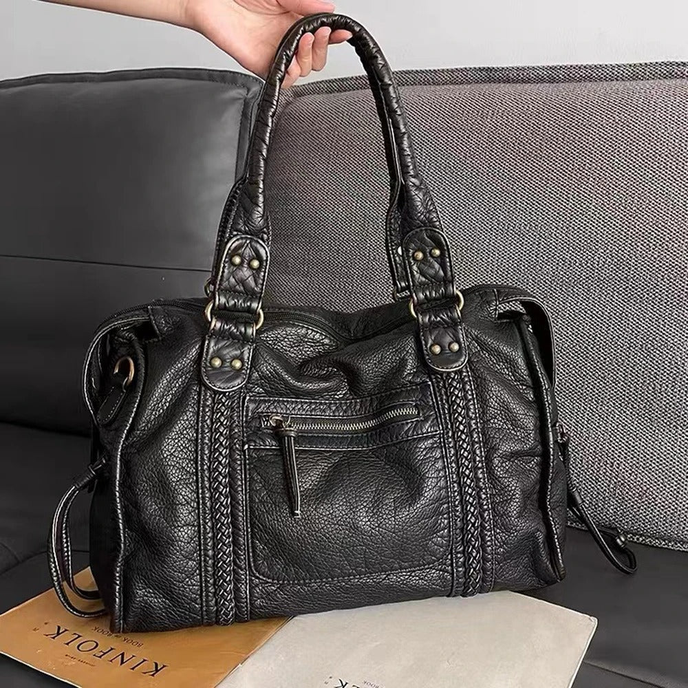 Detailaufnahme der Vintage Damen Handtasche Marisol aus hochwertigem Leder, zeigt Textur und Verarbeitung.