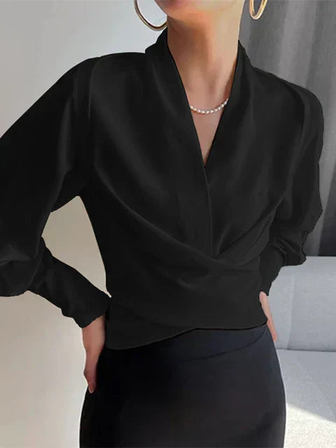 Modische Damenbluse mit V-Ausschnitt und Puffärmeln. Ideales elegantes Oberteil für Sommer und besondere Anlässe.