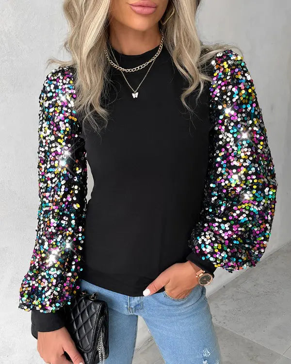 Modische Damenbluse mit farbigen Ballonärmeln & glitzernden Pailletten. Ein elegantes Langarm-Oberteil für Frauen.
