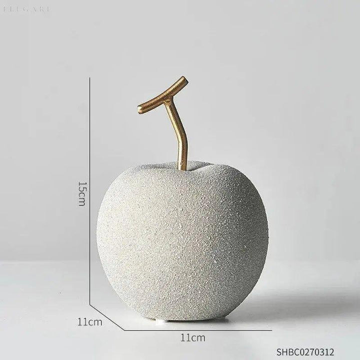 Set aus minimalistischen Apfel- & Birnen-Deko-Figuren aus goldfarbenem Harz für stilvolle Wohndekoration.