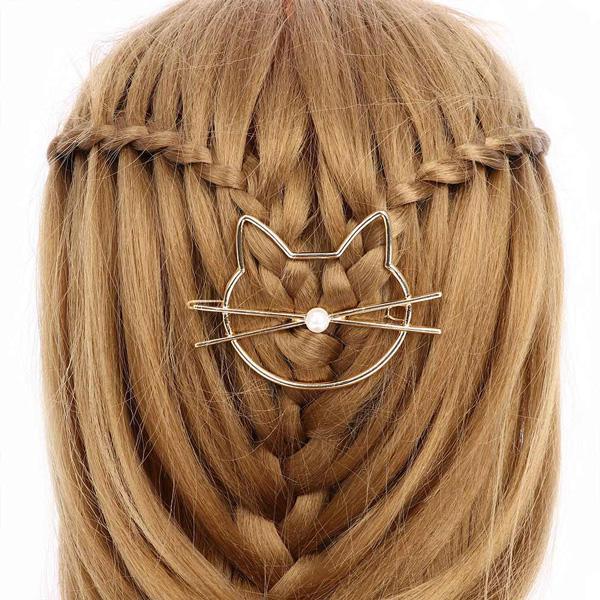 Luxuriöse Katzenhaarspange mit Perle für elegante Frisuren. Gold- und silberfarbener Haarschmuck für besondere Anlässe.