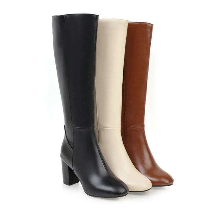 Hochwertige knielange Damenstiefel mit bequemem Absatz und praktischem Reißverschluss. Ideal für den Herbst.