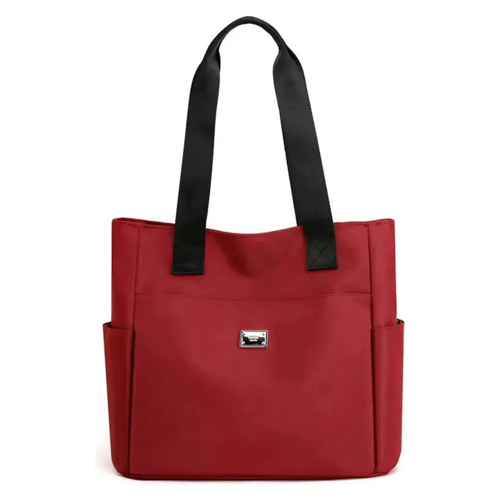 Vielseitige Reisetasche für Damen: wasserdichte Nylontasche, leicht und elegant, mit ausreichend Platz für Essentials.