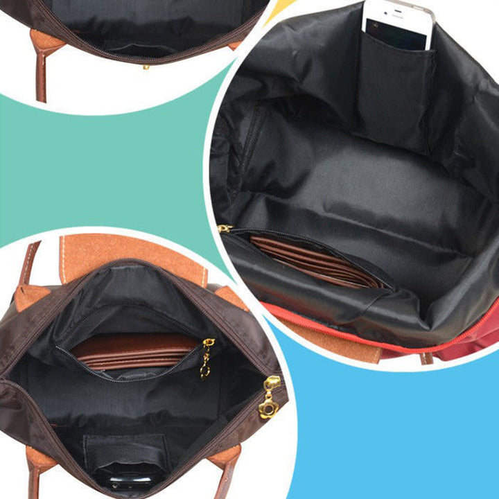 Geräumige Oxford Handtasche in Schwarz mit Innenfächern zur Organisation von Damen-Essentials.