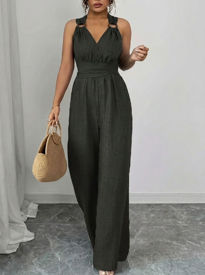 Eleganter Damen Jumpsuit & Spitzenoberteil Ensemble in Schwarz mit Taschen, perfekt für Abendmode.
