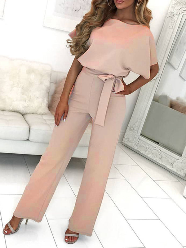 Eleganter Damen Overall in Rosa mit Rüschengürtel & kurzen Ärmeln, ideal als bequeme Freizeitmode.