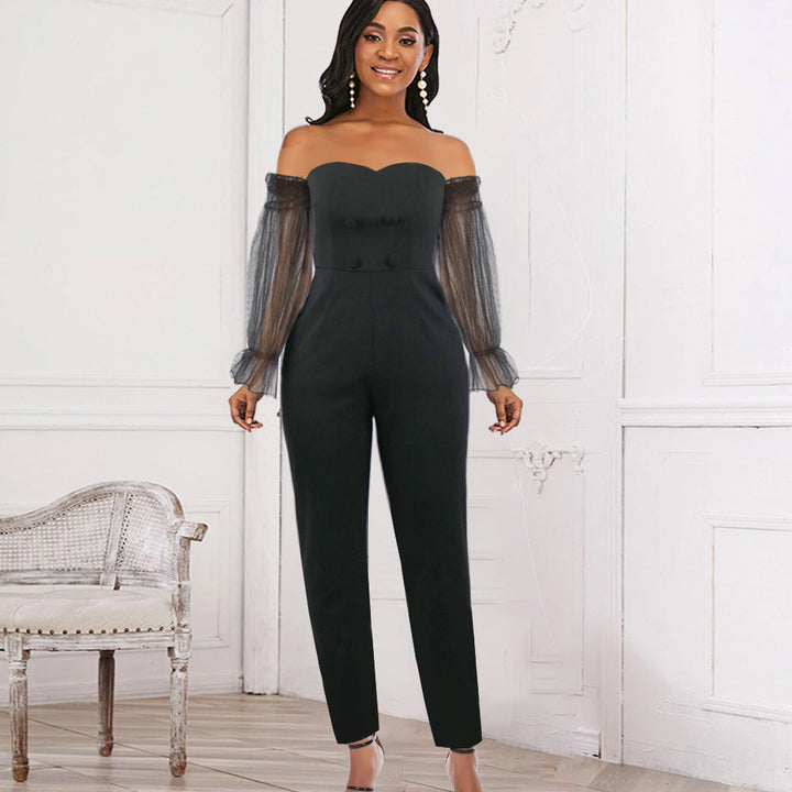 Eleganter schwarzer Damen Jumpsuit mit transparenten Puffärmeln, ideal für Abend & Party. Stilvolle Frauen Mode.