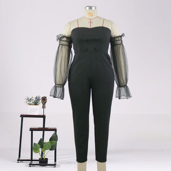 Schwarzer Damen Jumpsuit mit stilvollen transparenten Puffärmeln, perfekt für festliche Anlässe & Party Outfits.