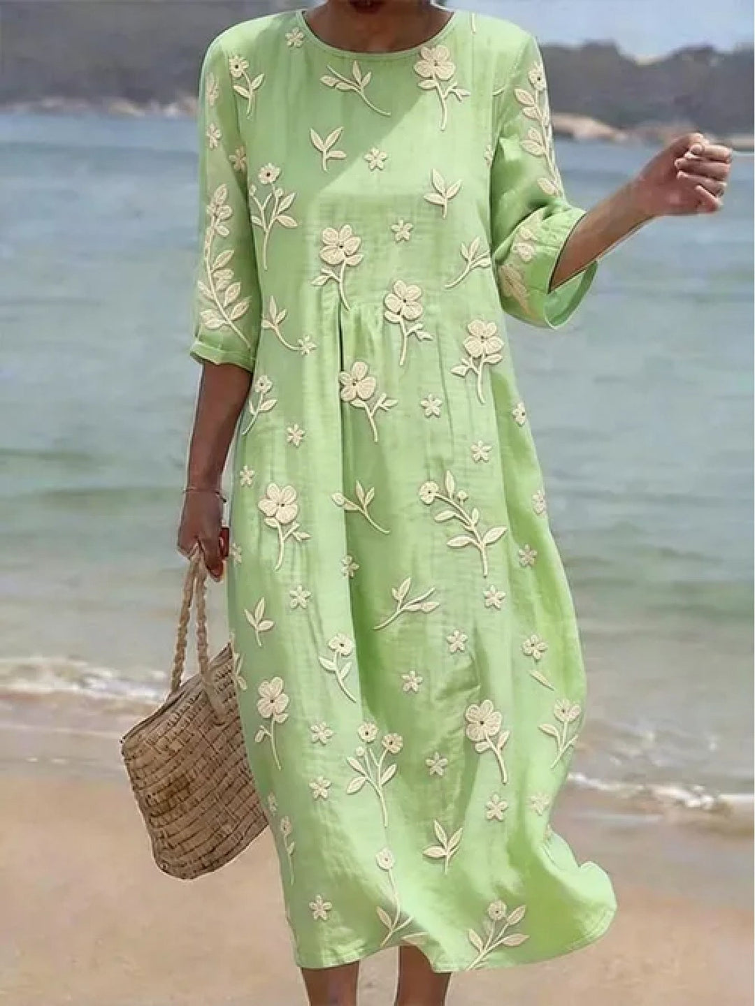 Elegantes, besticktes Damen-Midikleid mit Blumenmuster, A-Linie, Dreiviertelärmeln; ideal für festliche Anlässe.