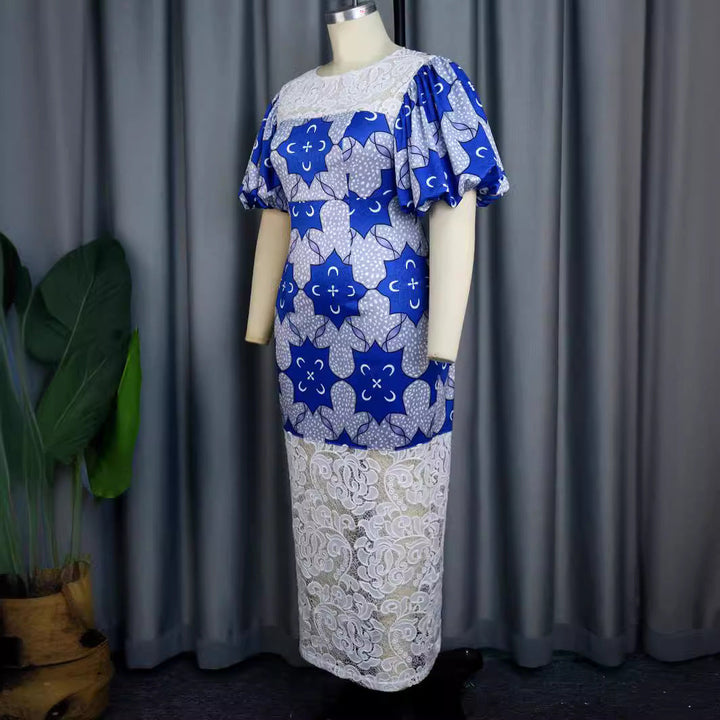 Blaues, elegantes Damenkleid im Midischnitt mit Langarm, zartem Blumenmuster und modischen Puffärmeln.